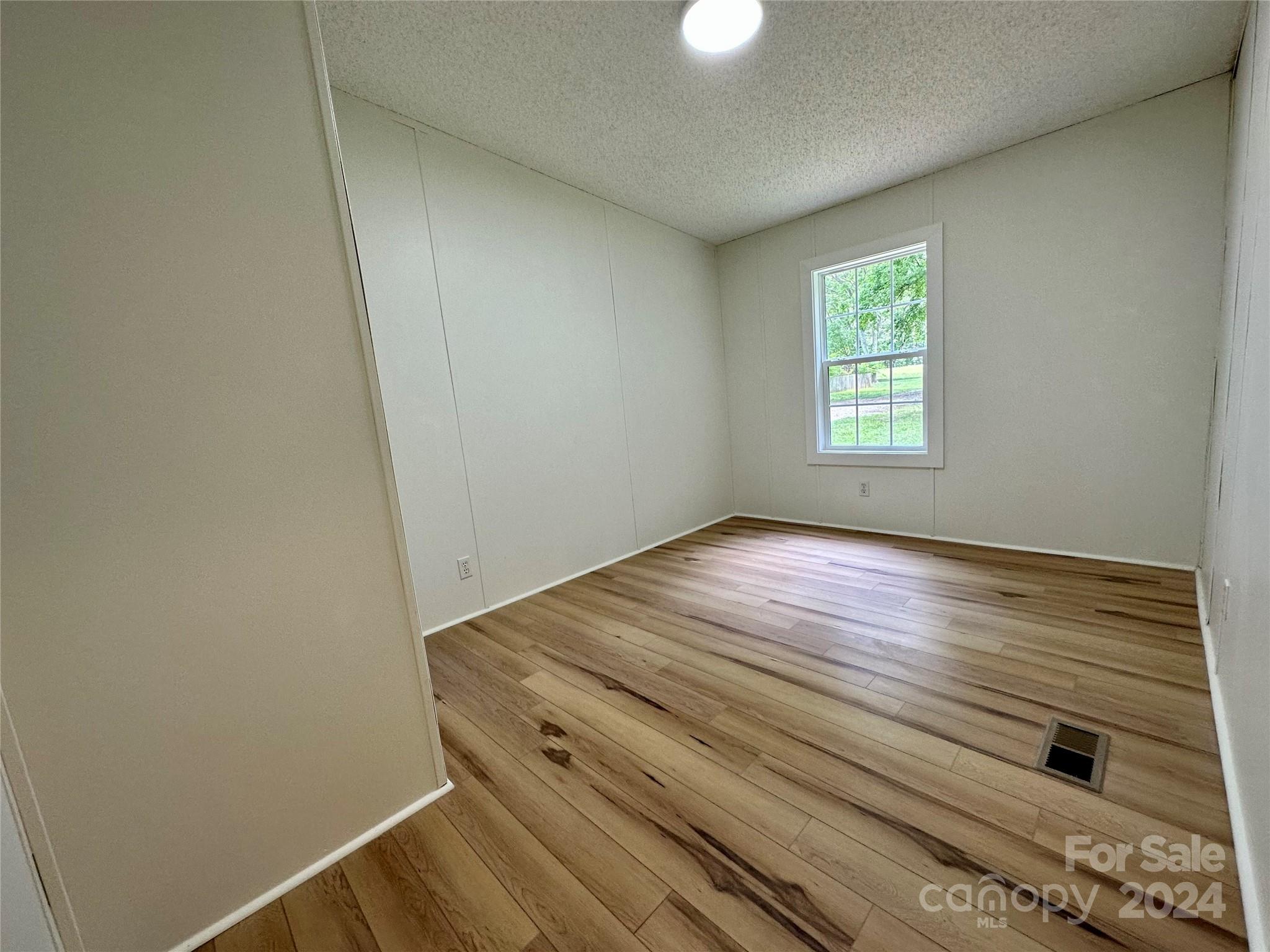 6686 Old Plank Road Stanley, NC 28164 - Photo 14 of 17 an empty room with window
