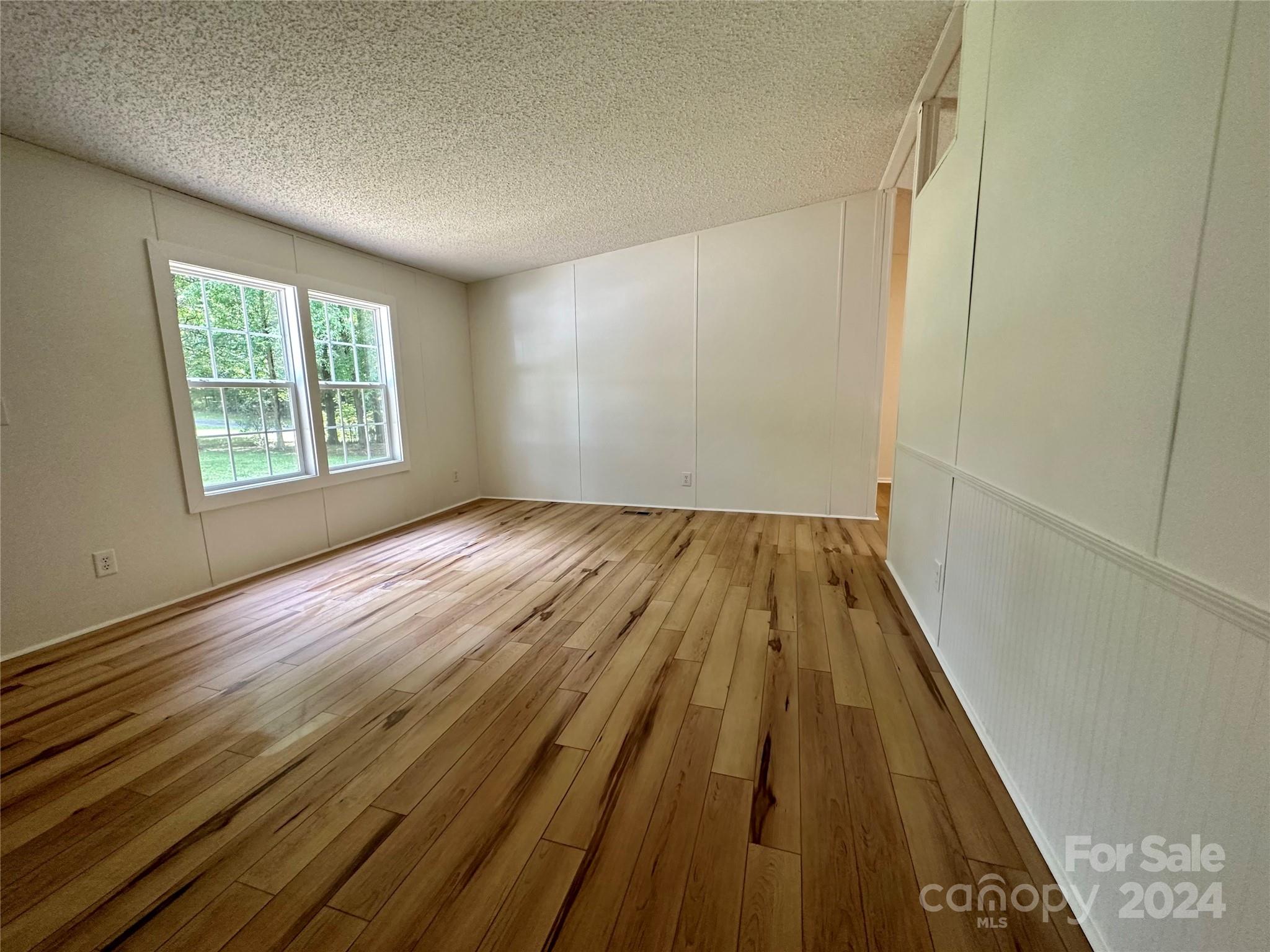 6686 Old Plank Road Stanley, NC 28164 - Photo 7 of 17 a view of wooden floor in a room