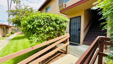 a view of a chair and table in the balcony