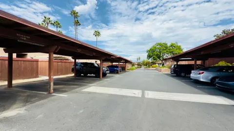 a view of street with parked cars