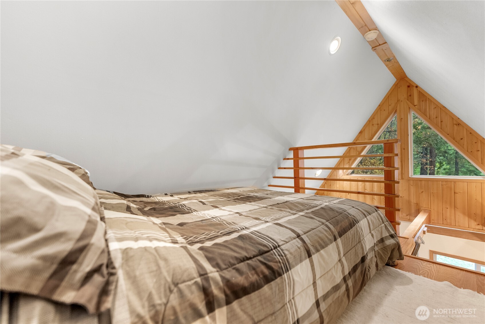 26 Mercer Road Mazama, WA 98833 - Photo 23 of 40 a bedroom with a bed and a window