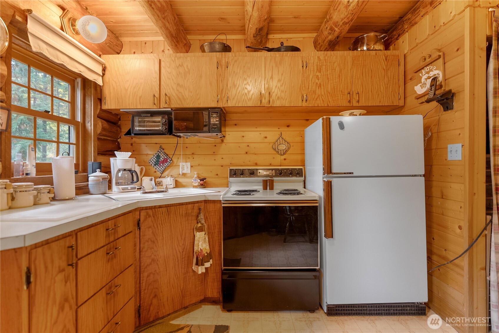 26 Mercer Road Mazama, WA 98833 - Photo 3 of 40 a kitchen with stainless steel appliances granite countertop a refrigerator and a sink
