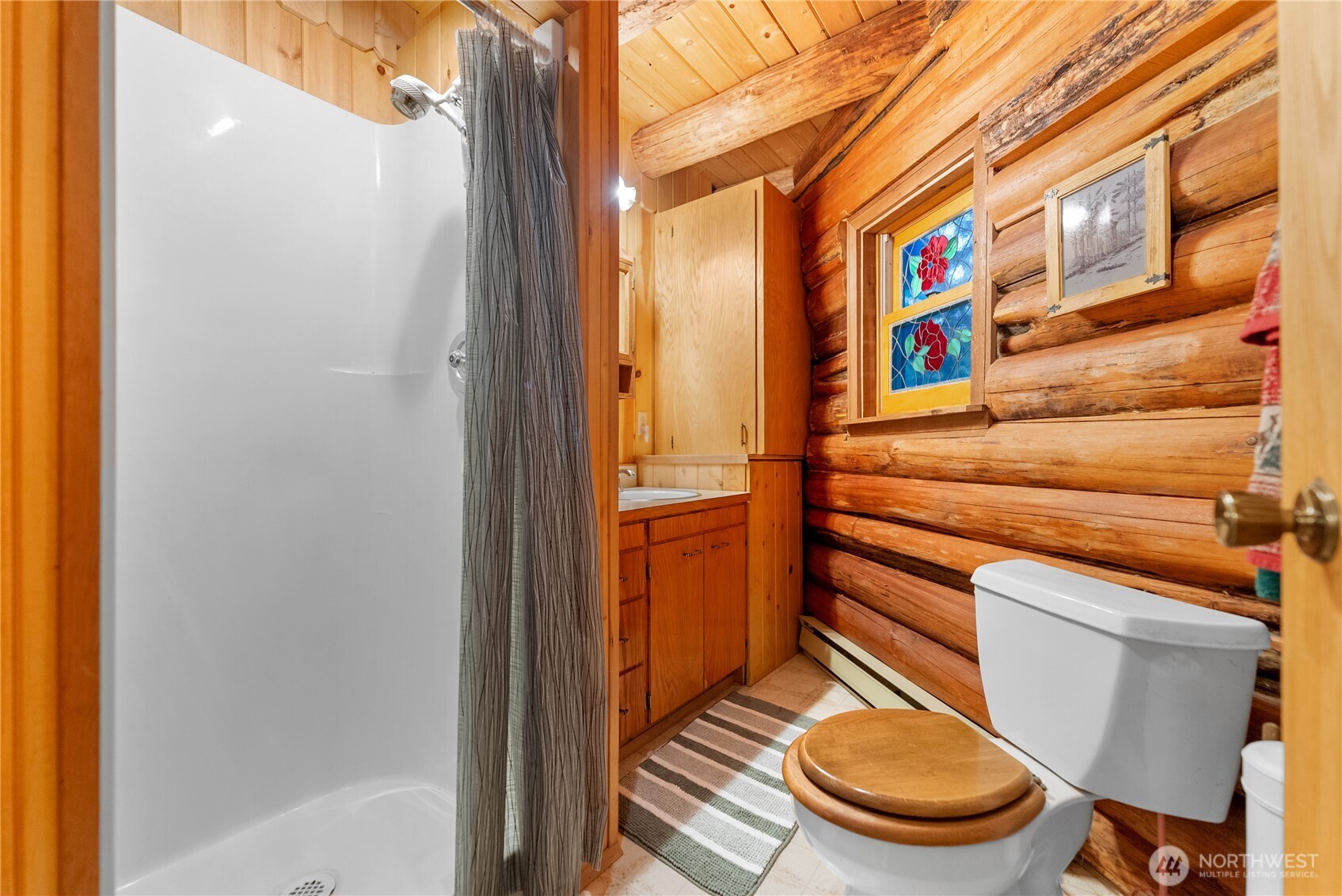 26 Mercer Road Mazama, WA 98833 - Photo 10 of 40 a bathroom with a toilet and a sink