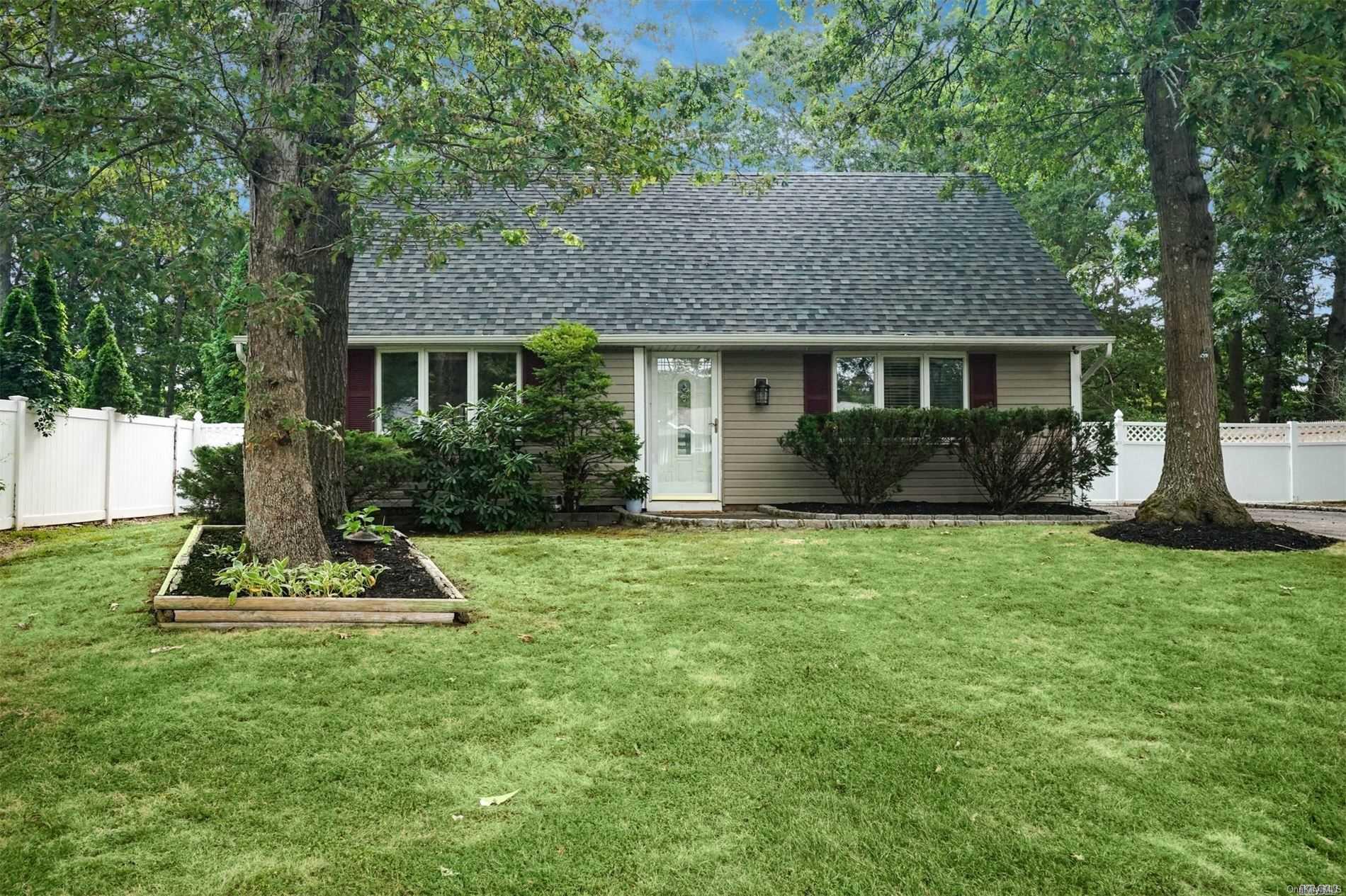 27 Highview Lane Ridge, NY 11961 - Photo 1 of 1 a front view of house with yard and green space