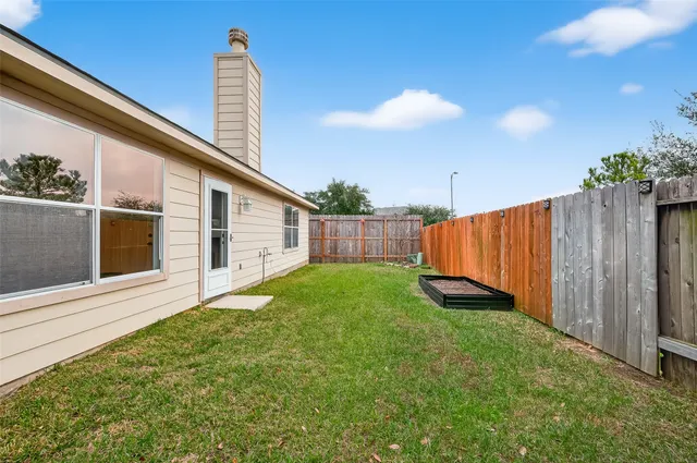 a view of a backyard with potted plants