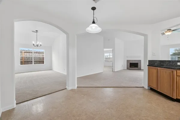a view of a livingroom with a fireplace cabinets and furniture
