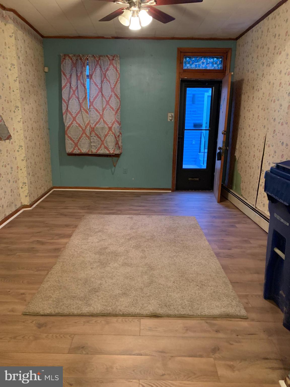 116 South Durham Street Baltimore, MD 21231 - Photo 5 of 56 First level with new laminate floors