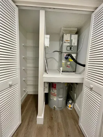 a view of a room with shelf on the wall