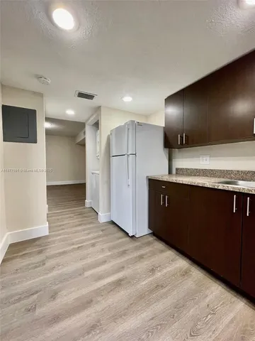 a view of kitchen with a sink