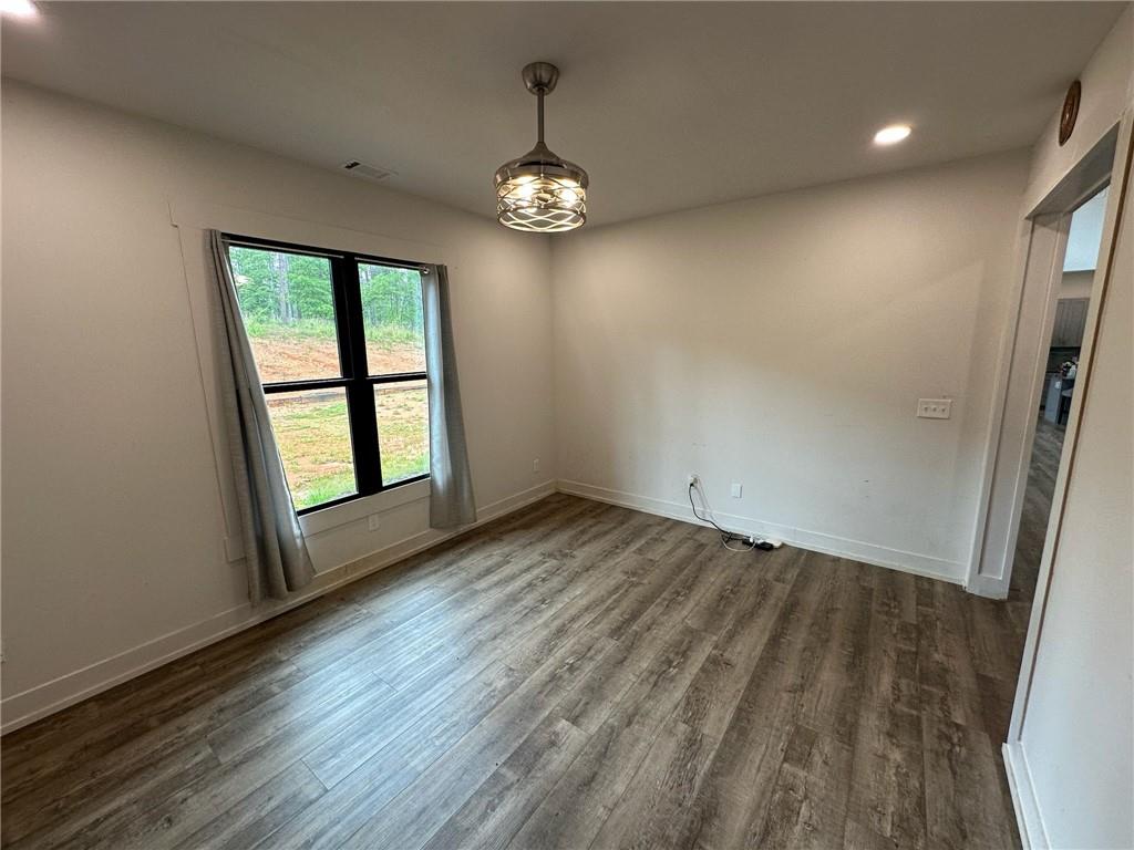 1001 Bailey Road Rome, GA 30161 - Photo 15 of 44 an empty room with wooden floor and windows