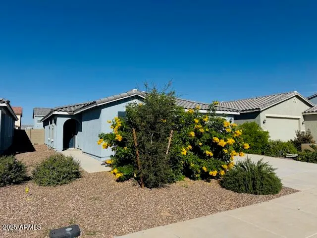 a view of a house with a street