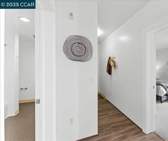 a spacious bedroom with a bed and a window