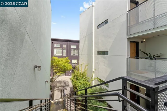 a view of a dinning table and chairs in backyard of the house