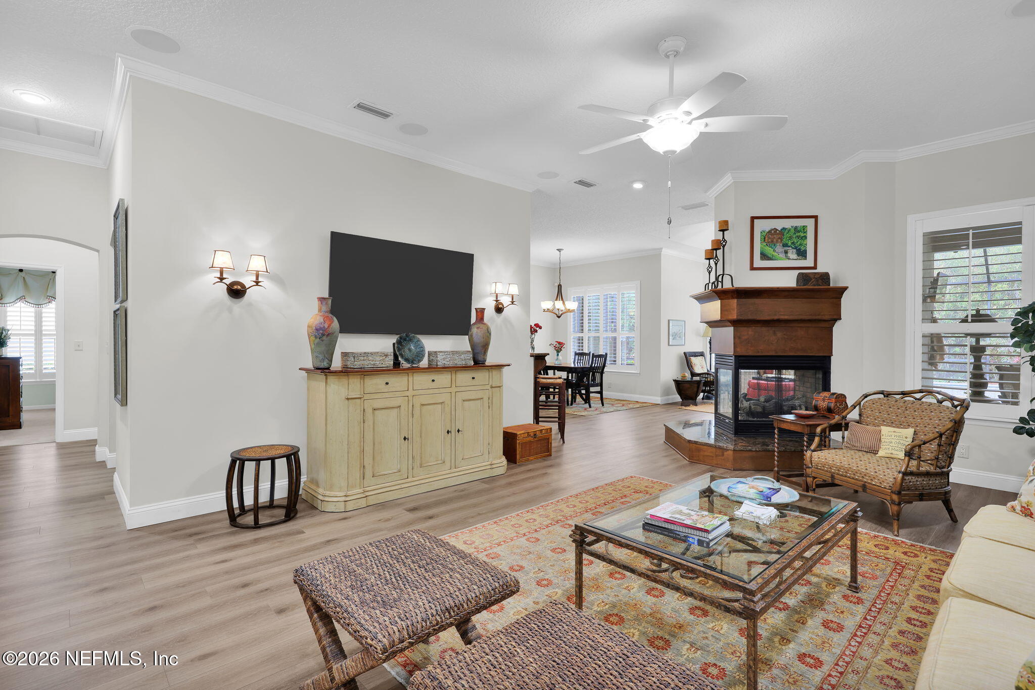 157 Oak Common Avenue St. Augustine, FL 32095 - Photo 13 of 57 a living room with furniture a flat screen tv and kitchen view