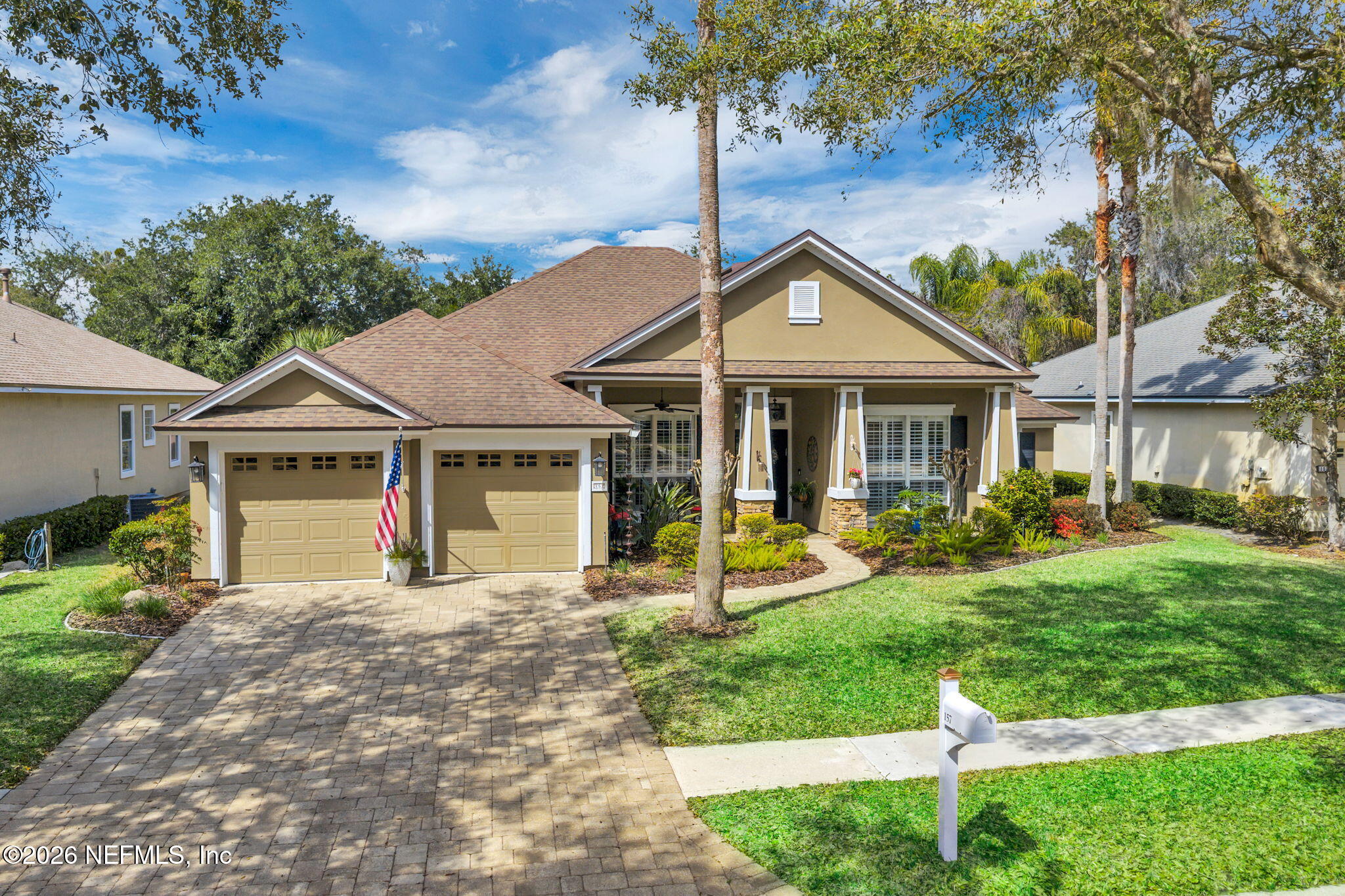 157 Oak Common Avenue St. Augustine, FL 32095 - Photo 2 of 57 a house with garden in front of it