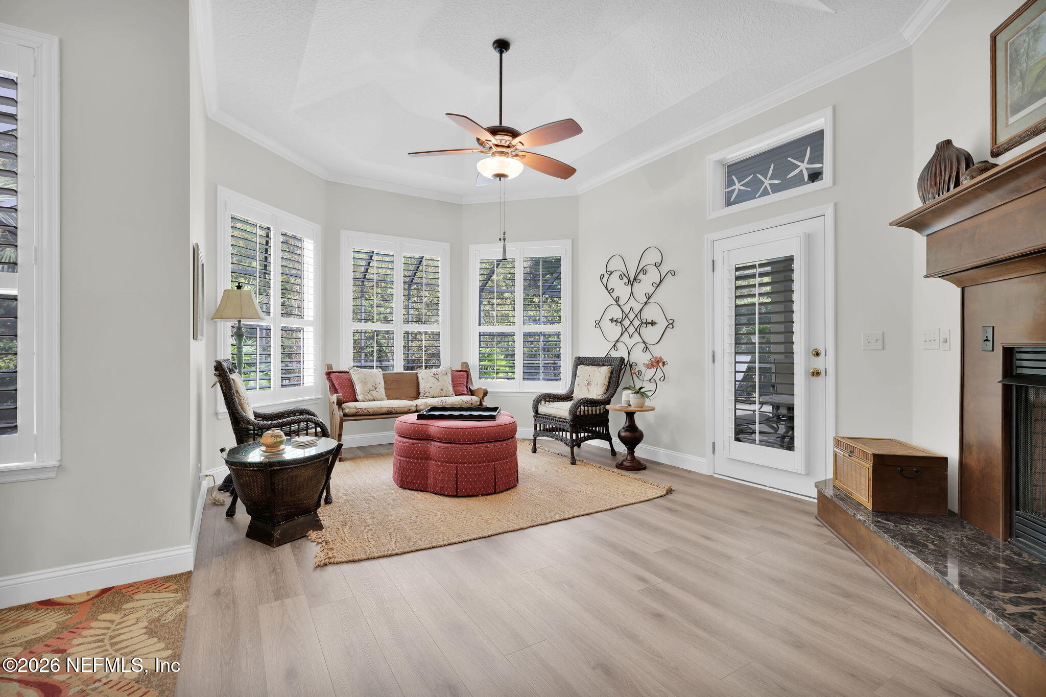 157 Oak Common Avenue St. Augustine, FL 32095 - Photo 22 of 57 a living room with furniture and a fireplace