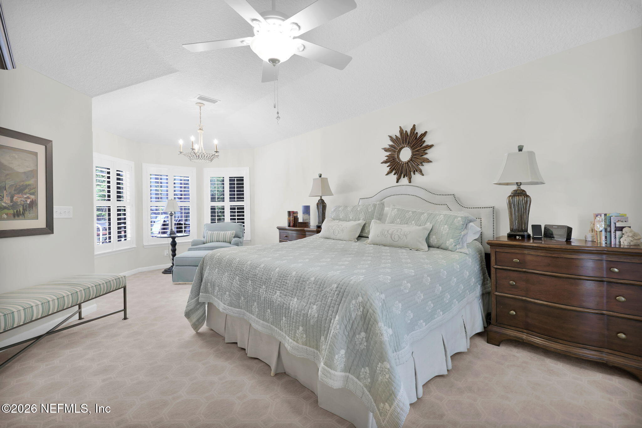 157 Oak Common Avenue St. Augustine, FL 32095 - Photo 24 of 57 a spacious bedroom with a bed and ceiling fan