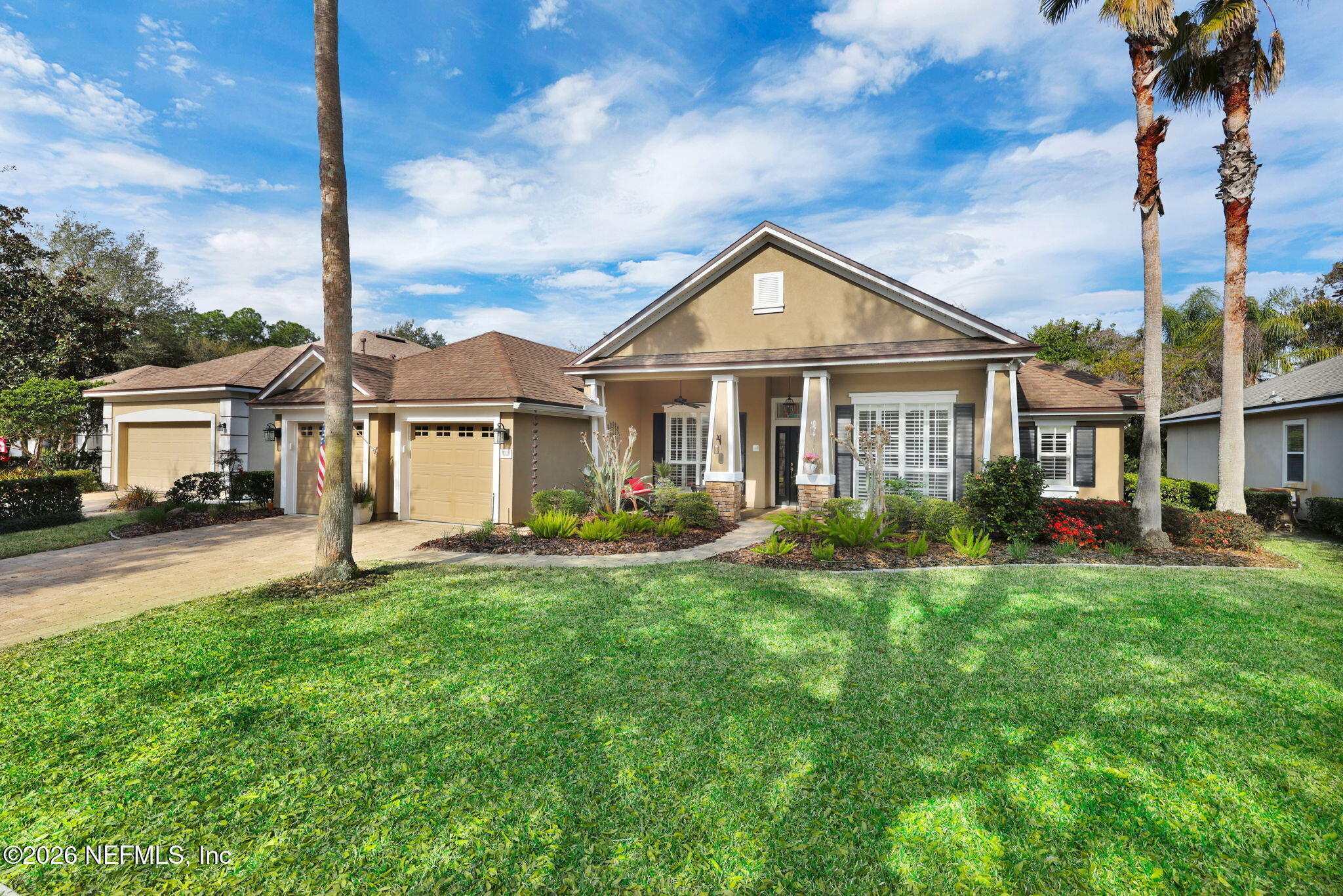 157 Oak Common Avenue St. Augustine, FL 32095 - Photo 4 of 57 a front view of a house with a yard