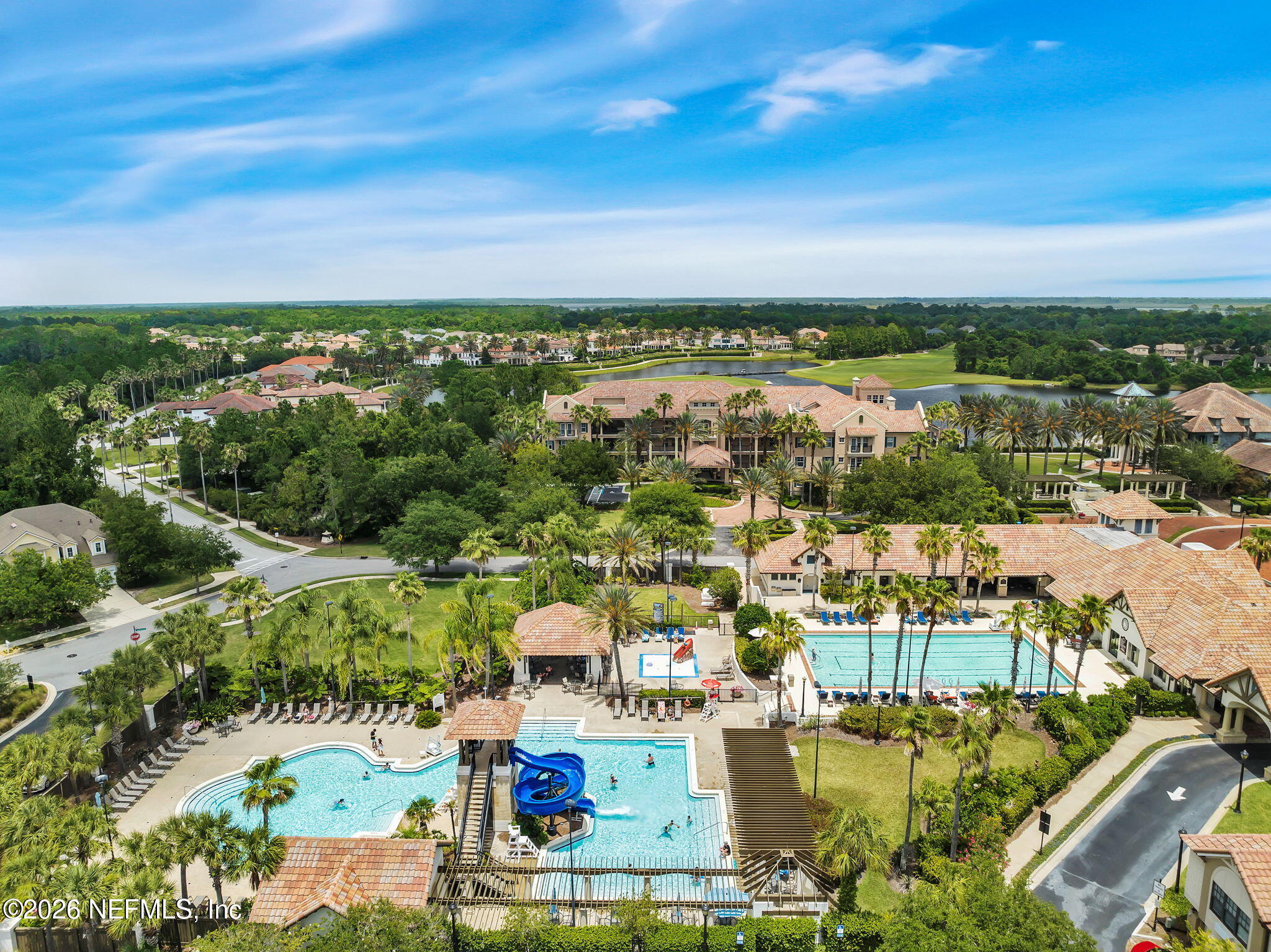 157 Oak Common Avenue St. Augustine, FL 32095 - Photo 47 of 57 an aerial view of a city with lots of residential buildings ocean and mountain view in back