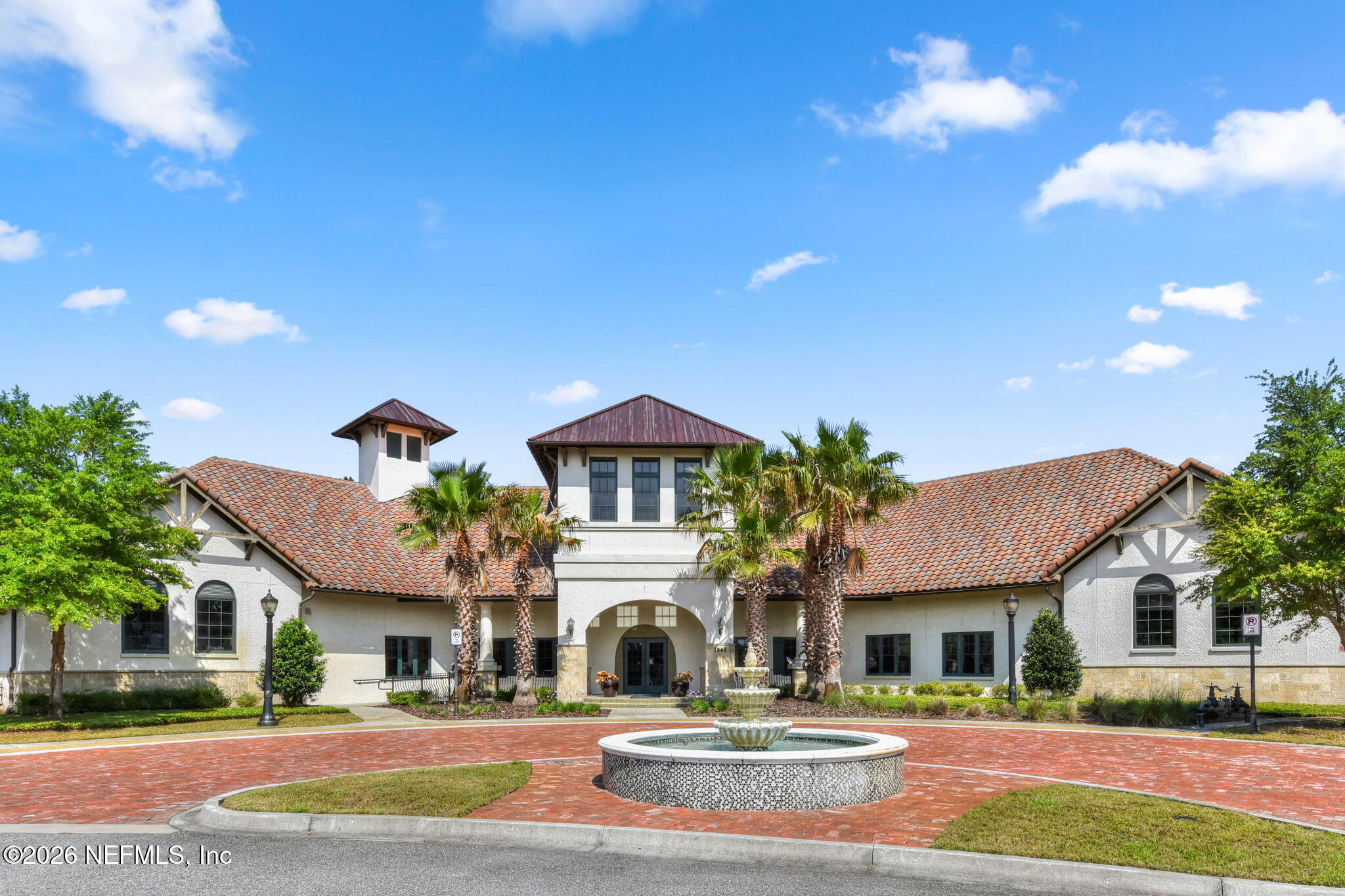 157 Oak Common Avenue St. Augustine, FL 32095 - Photo 49 of 57 a front view of a white house with a yard