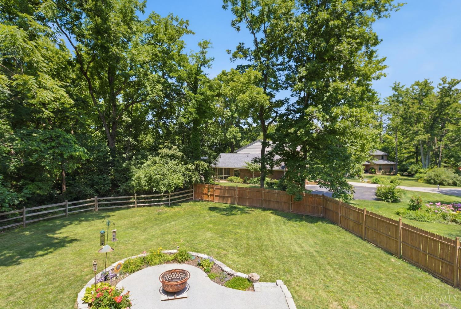 6400 Roth Ridge Drive Loveland, OH 45140 - Photo 34 of 40 Balcony off of primary bedroom overlooking the beautiful yard.