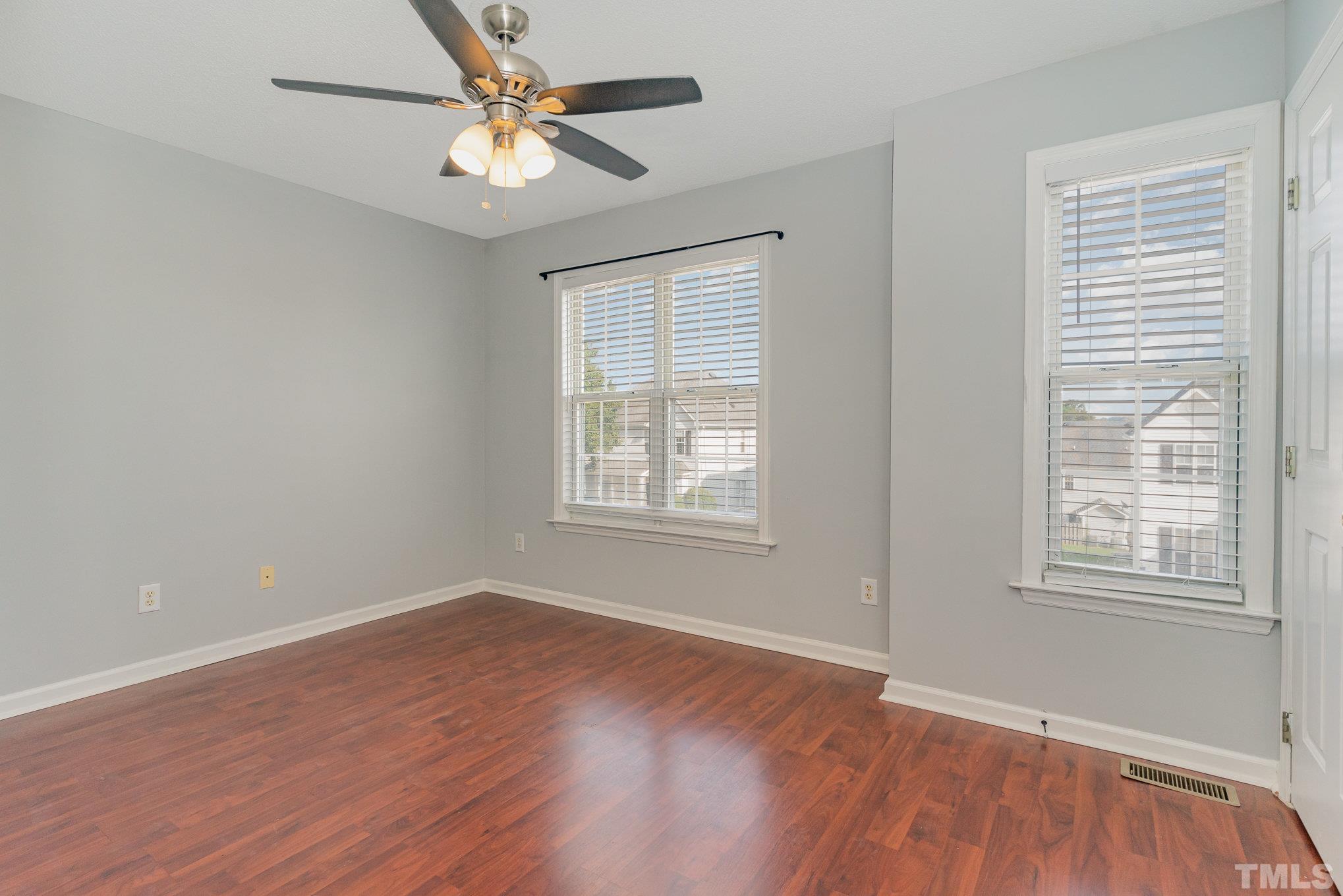 5339 Cog Hill Court Raleigh, NC 27604 - Photo 11 of 23 wooden floor in an empty room with a window