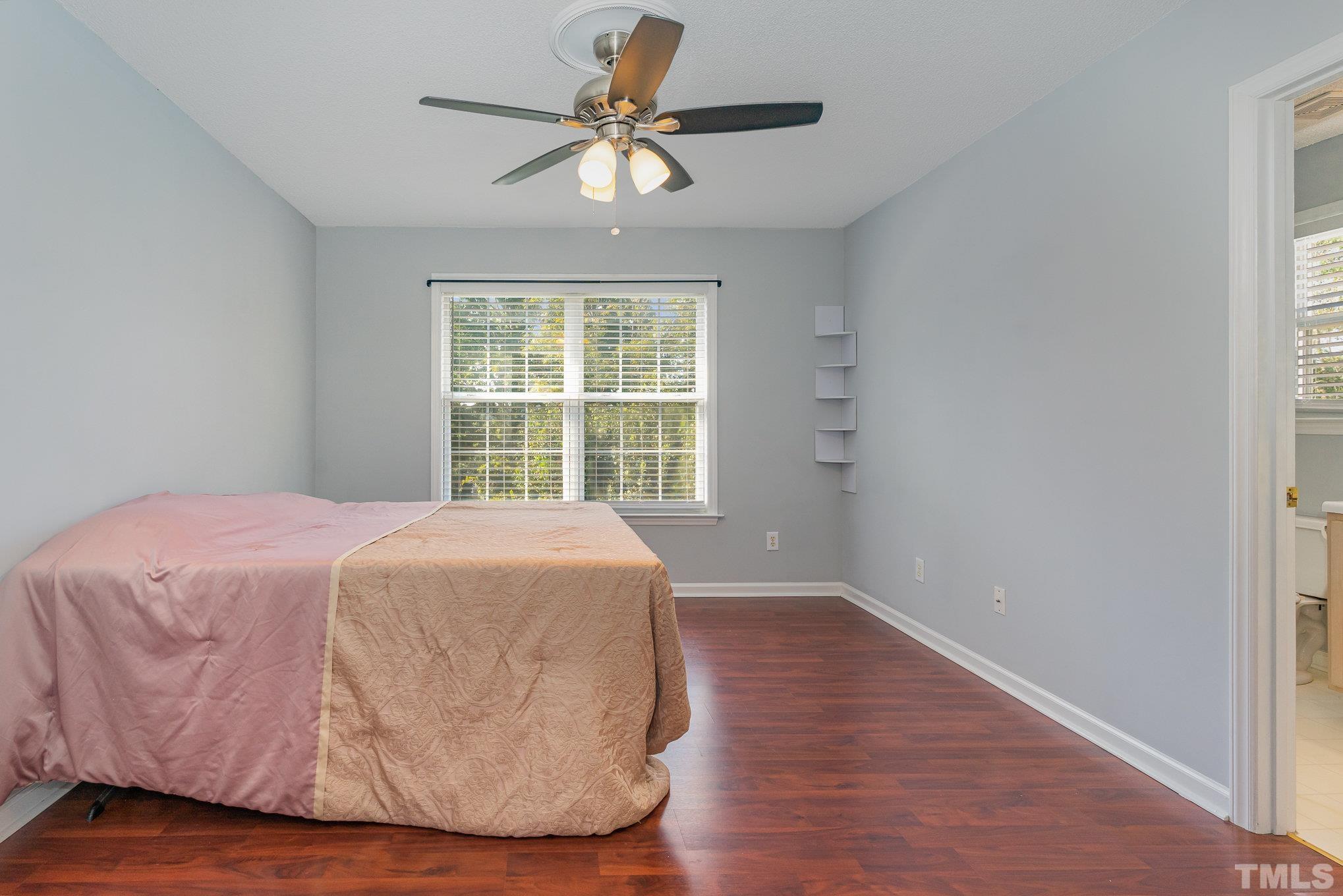 5339 Cog Hill Court Raleigh, NC 27604 - Photo 13 of 23 a bedroom with a bed and a window