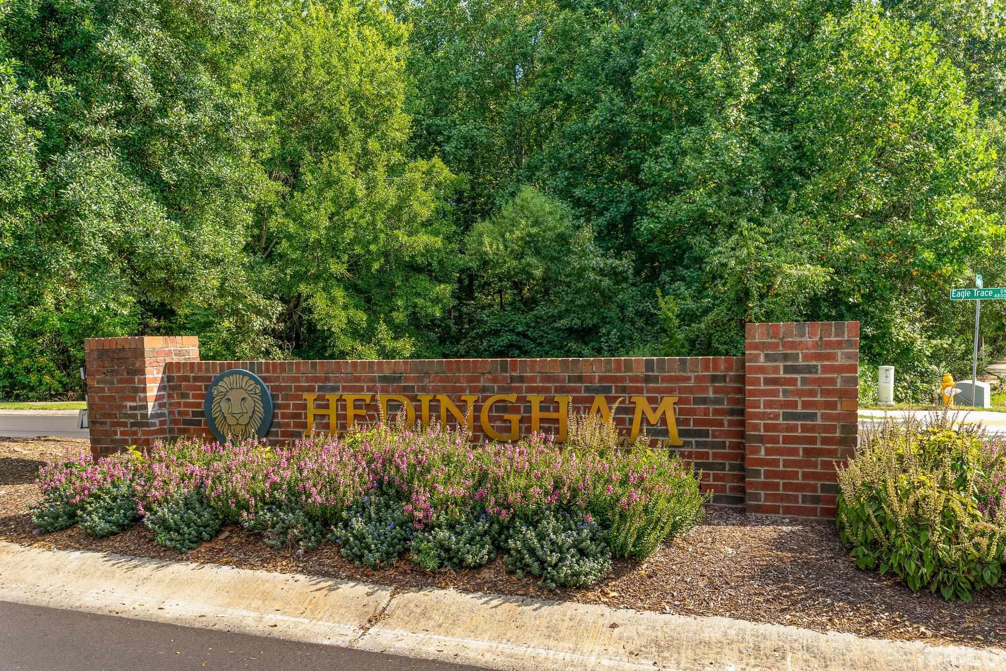 5339 Cog Hill Court Raleigh, NC 27604 - Photo 16 of 23 a view of sign board with flower plants