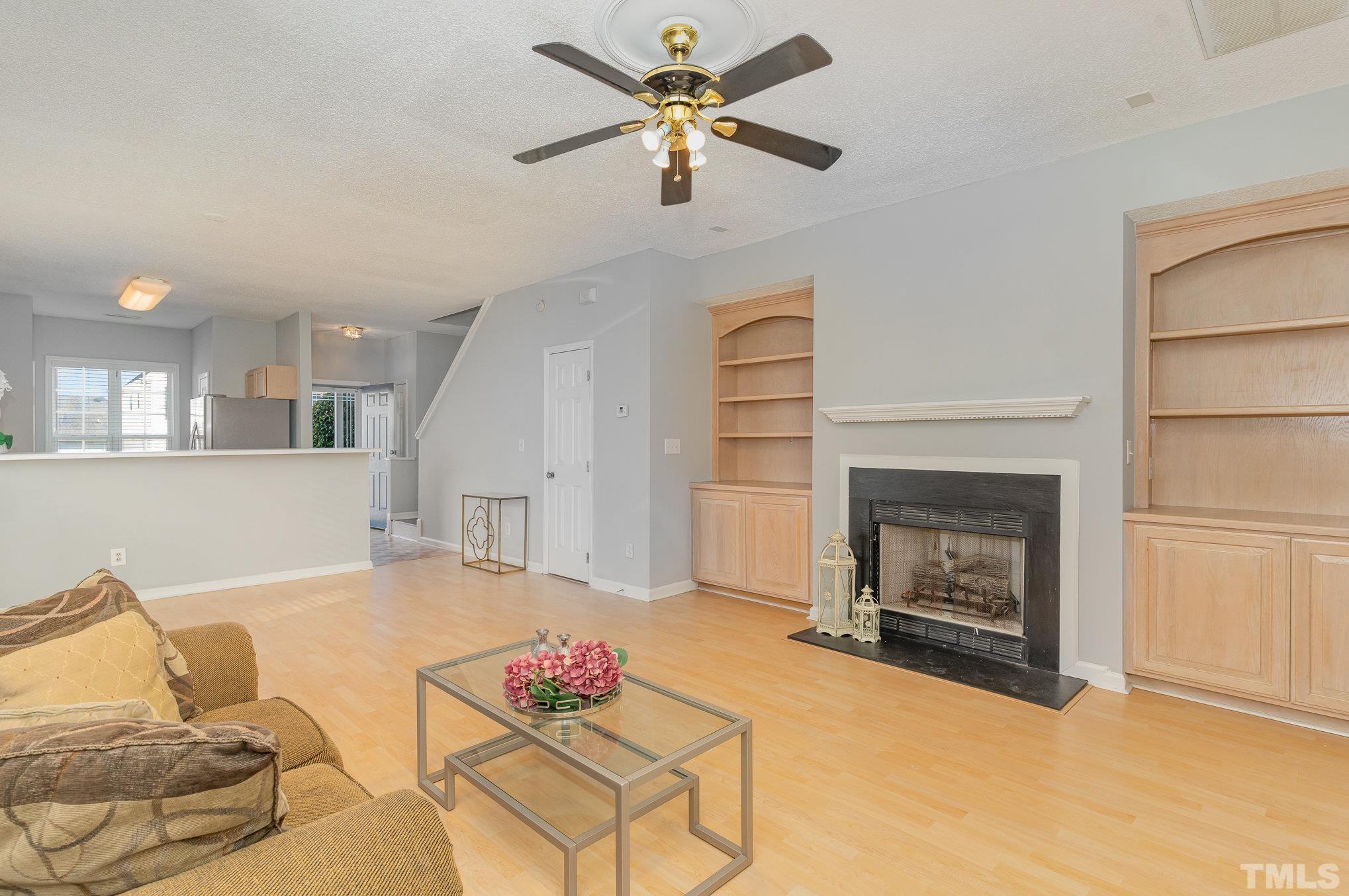 5339 Cog Hill Court Raleigh, NC 27604 - Photo 3 of 23 a living room with furniture and a fireplace