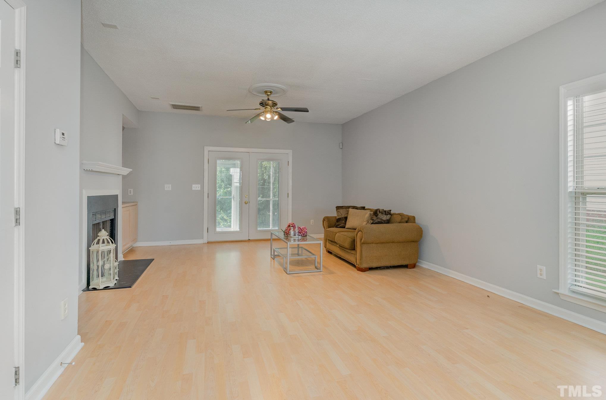 5339 Cog Hill Court Raleigh, NC 27604 - Photo 4 of 23 a living room with furniture and a ceiling fan