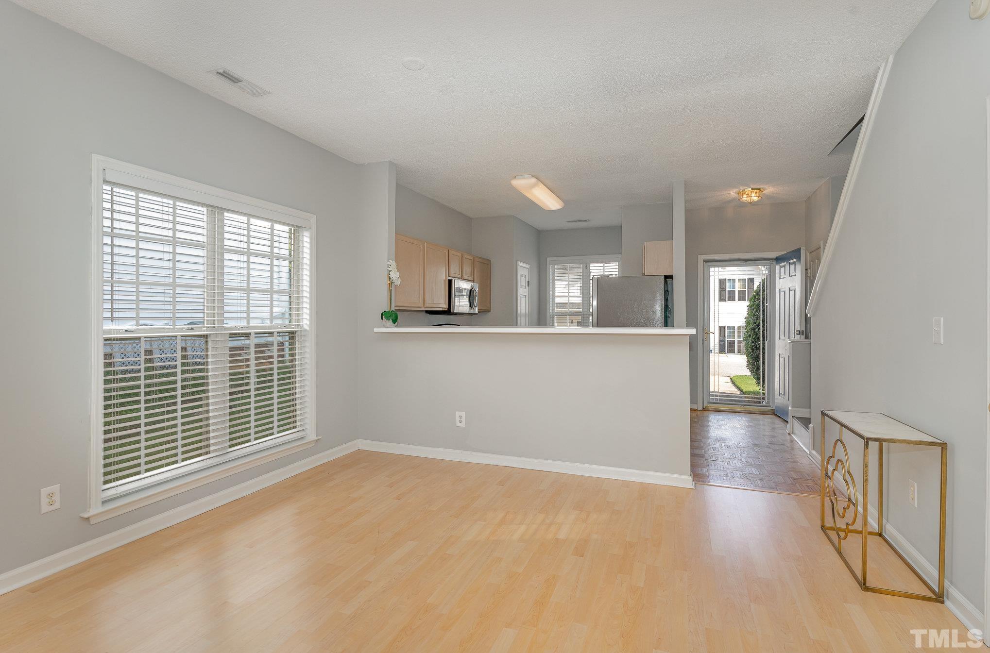 5339 Cog Hill Court Raleigh, NC 27604 - Photo 5 of 23 a view of a kitchen with an empty space and a window