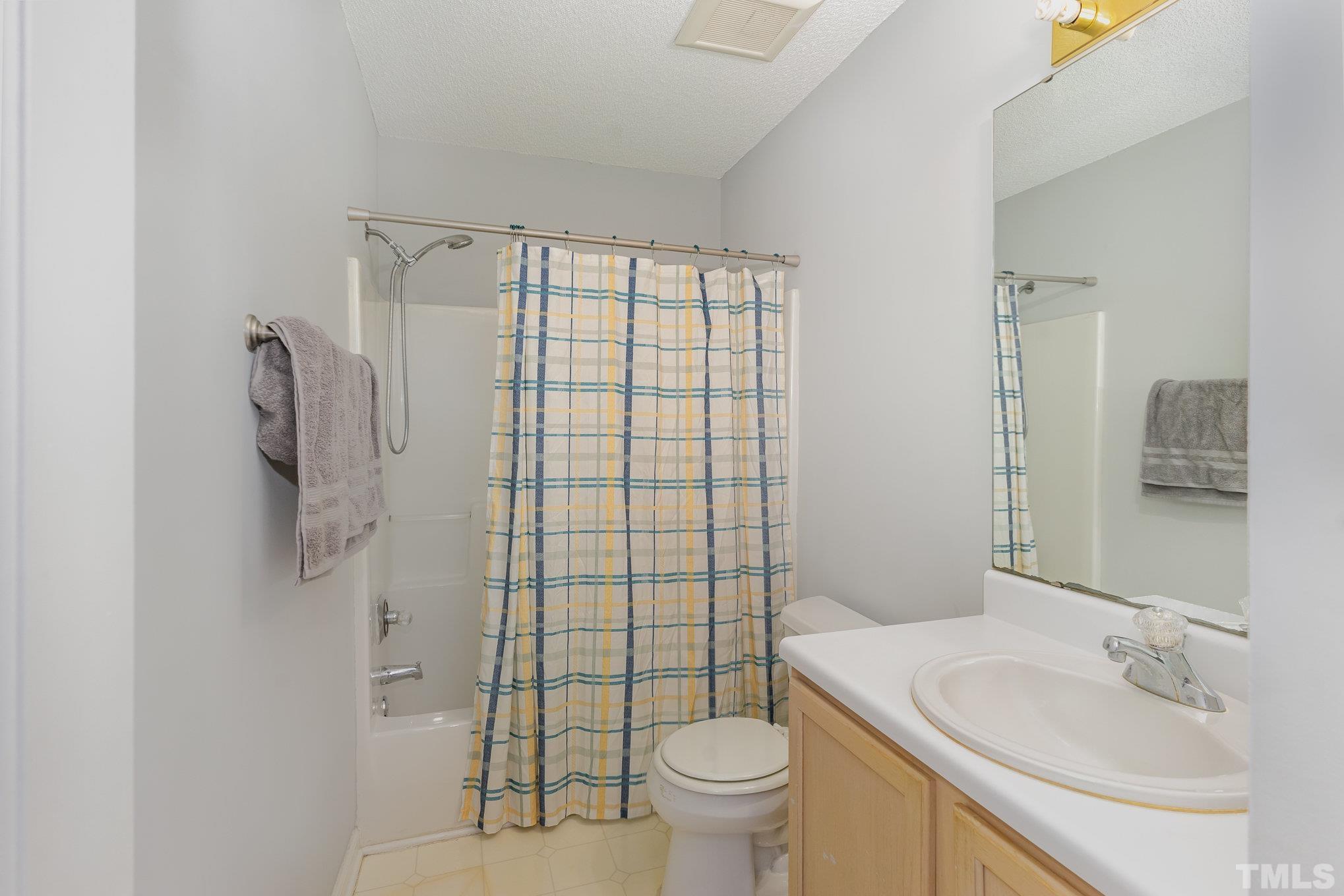 5339 Cog Hill Court Raleigh, NC 27604 - Photo 10 of 23 a bathroom with a sink toilet and shower