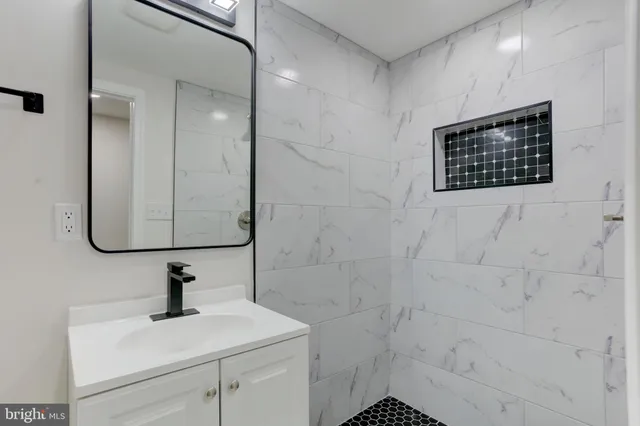 a view of room with wooden floor