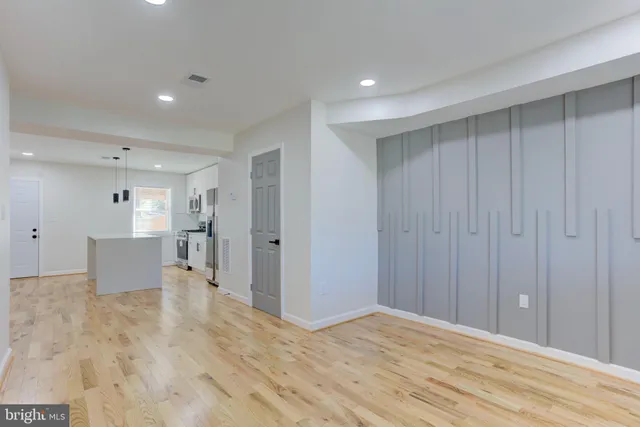 a view of a livingroom with wooden furniture