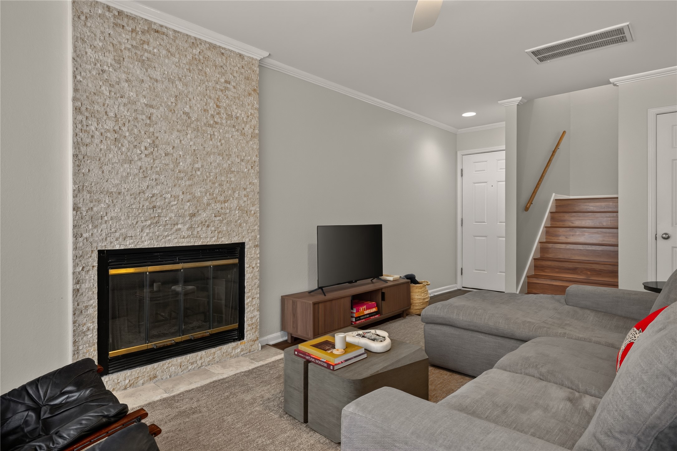 3845 Ranch Road 2222, Unit T2 Austin, TX 78731 - Photo 4 of 34 Relax on the sofa and watch TV or enjoy a fire in the fireplace.