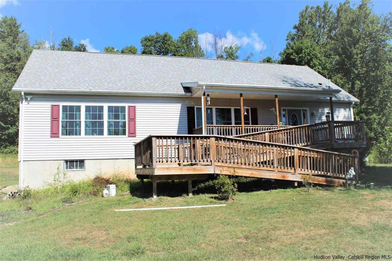 10 Iken Road Kerhonkson, NY 12446 - Photo 1 of 17 a house with trees in the background