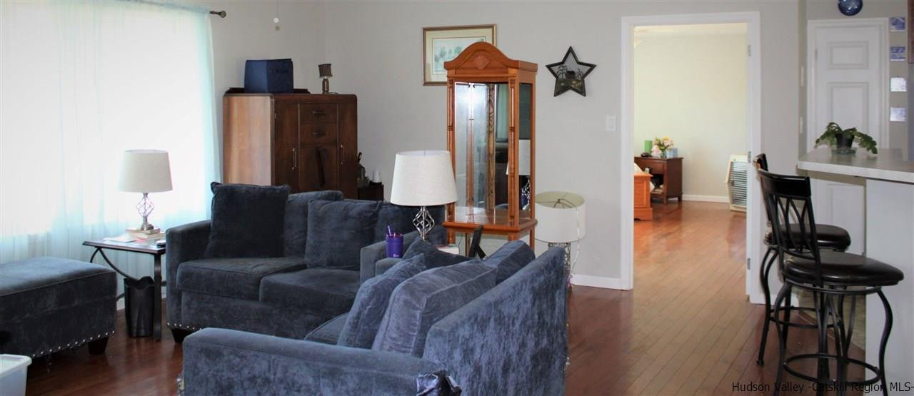 10 Iken Road Kerhonkson, NY 12446 - Photo 16 of 17 a living room with furniture and a fireplace