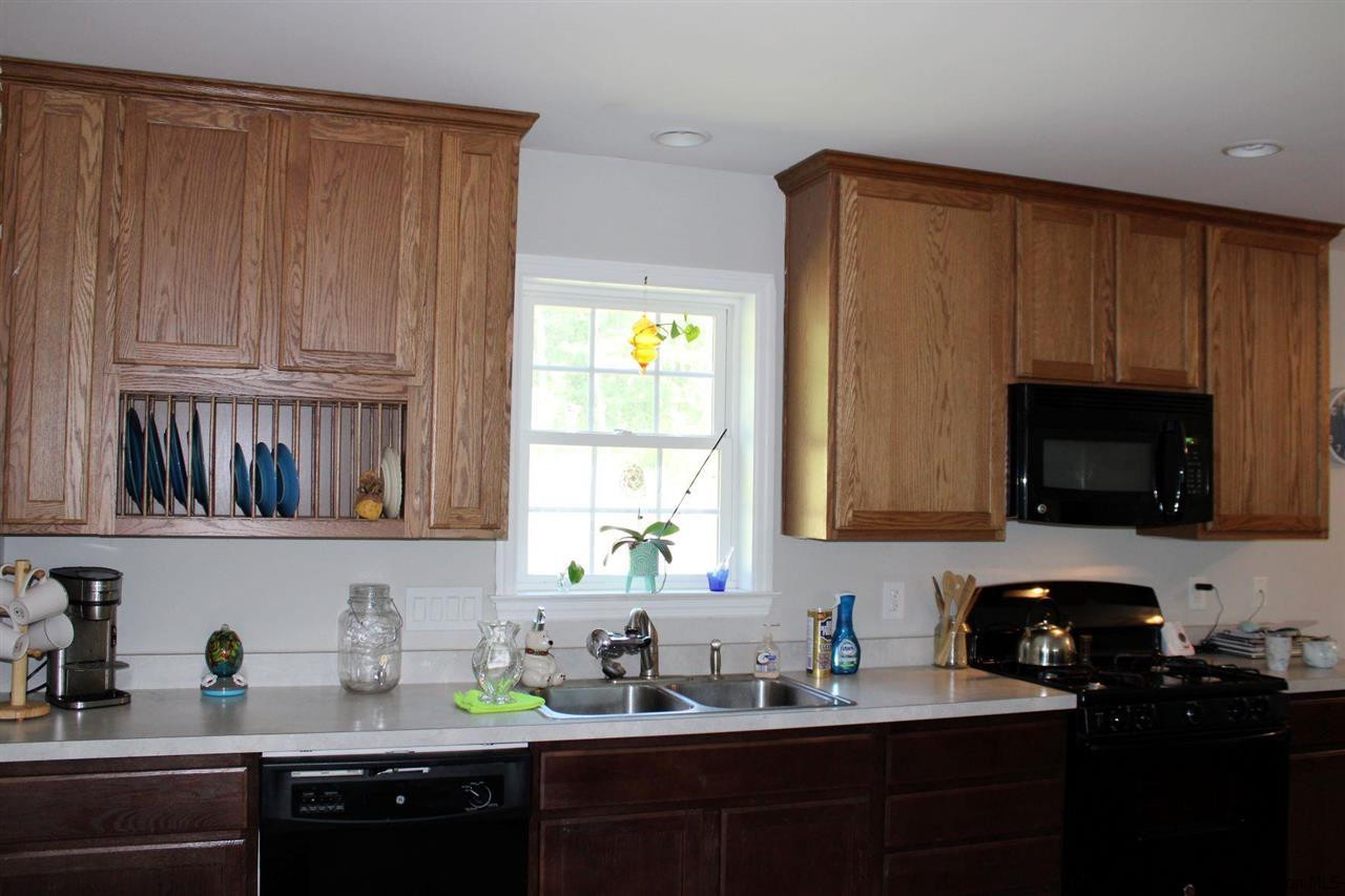 10 Iken Road Kerhonkson, NY 12446 - Photo 7 of 17 a kitchen with stainless steel appliances granite countertop a sink dishwasher stove and cabinets