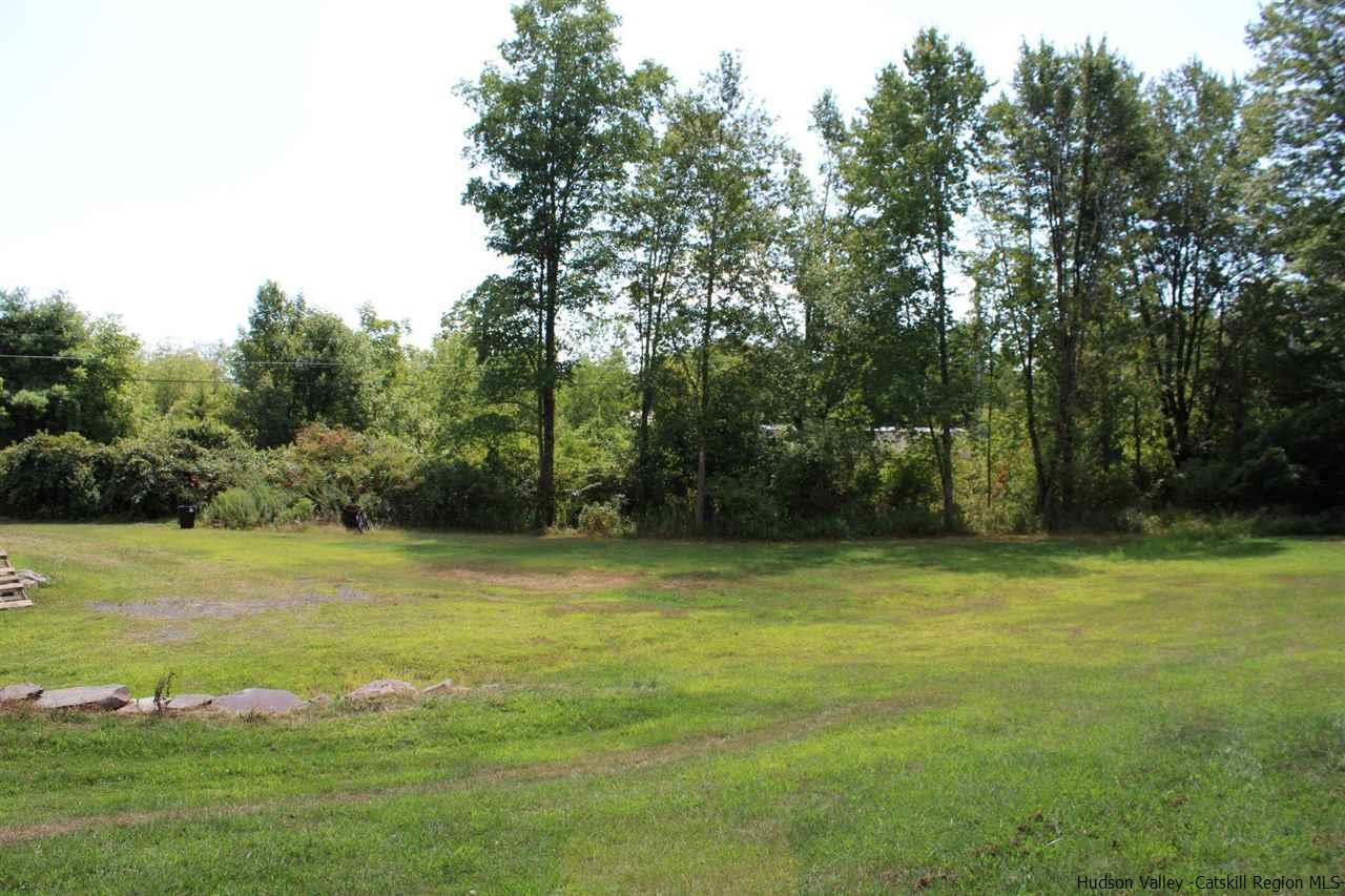 10 Iken Road Kerhonkson, NY 12446 - Photo 8 of 17 a view of a field with trees in the background