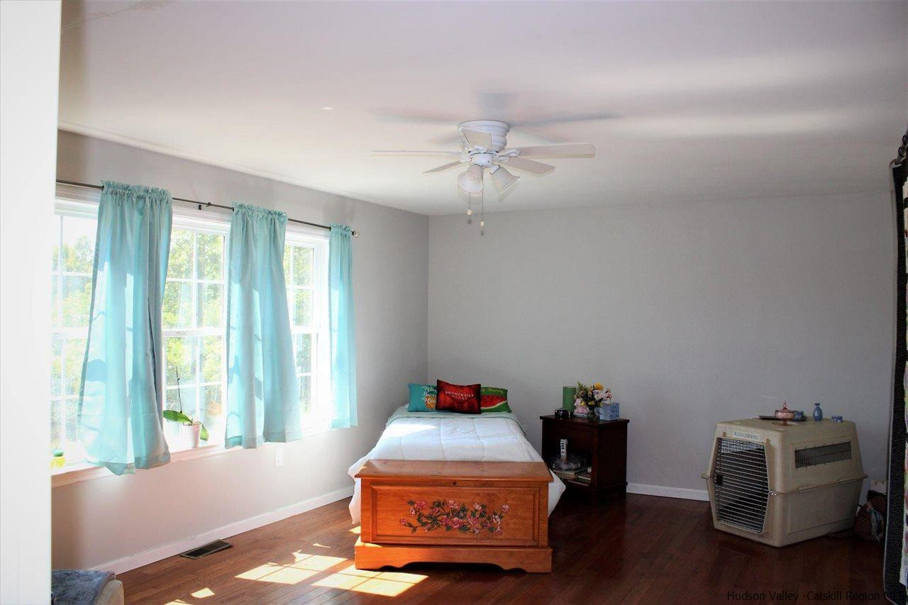 10 Iken Road Kerhonkson, NY 12446 - Photo 9 of 17 a bedroom with furniture and a window