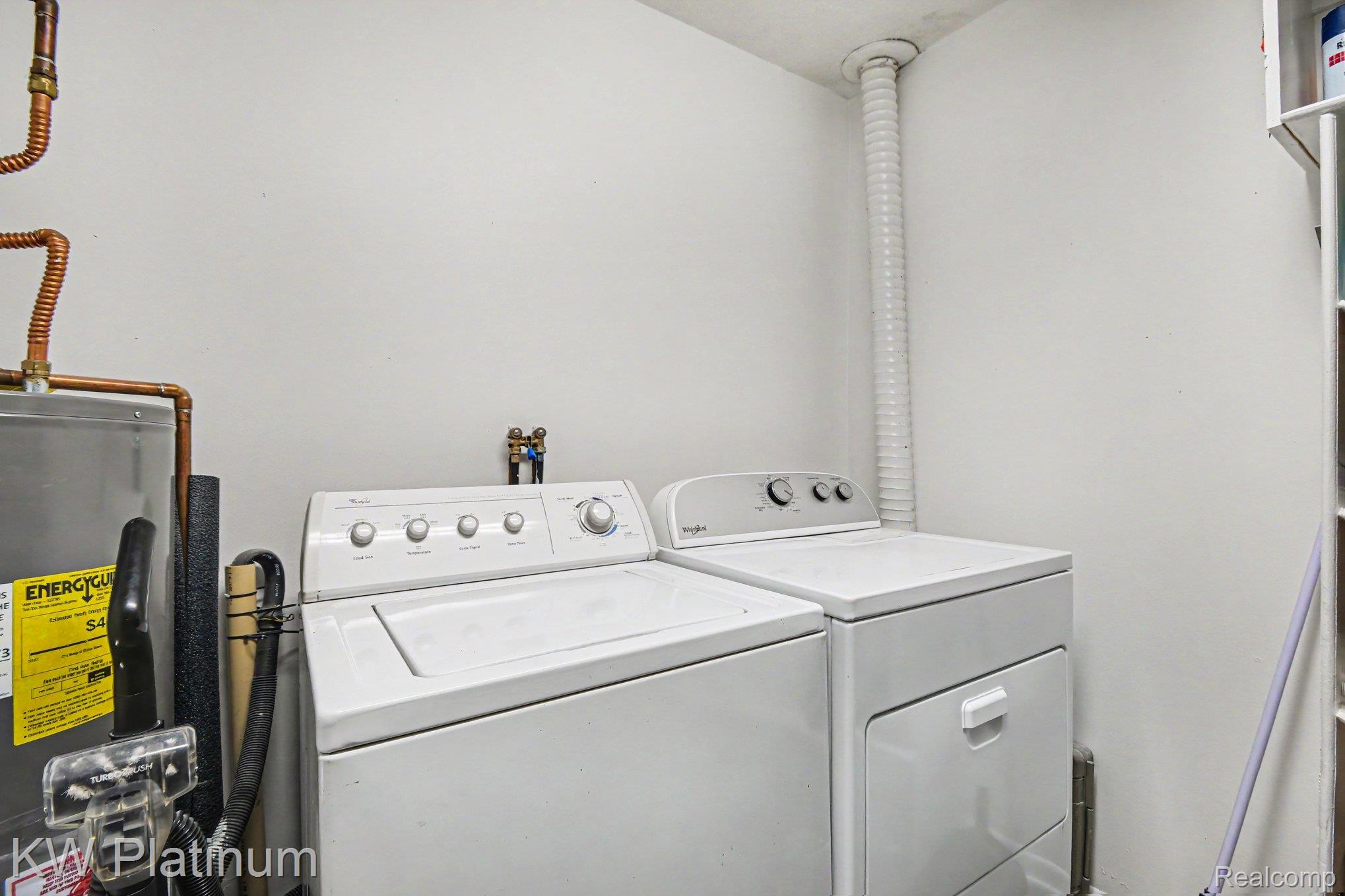 1900 River Road, Unit C5 Marysville, MI 48040 - Photo 14 of 15 Laundry area with water heater and separate washer and dryer