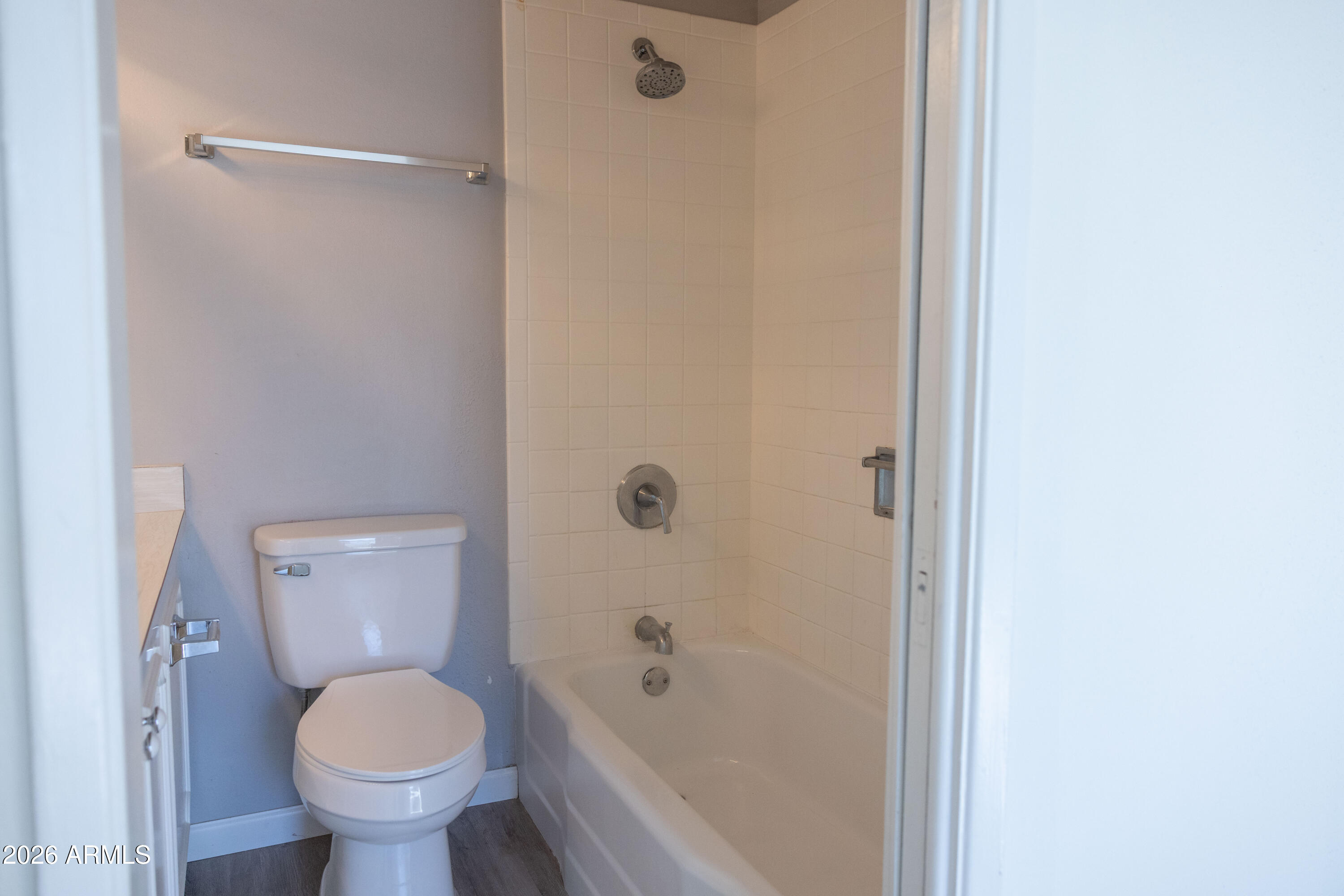 1450 East Bethany Home Road, Unit 31 Phoenix, AZ 85014 - Photo 11 of 24 a bathroom with a toilet and a shower