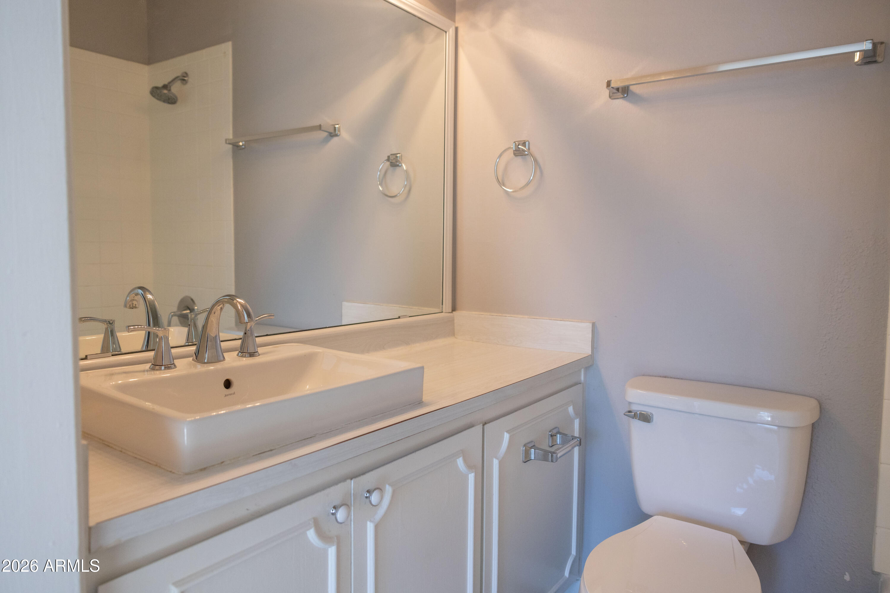 1450 East Bethany Home Road, Unit 31 Phoenix, AZ 85014 - Photo 12 of 24 a bathroom with a sink a toilet and shower