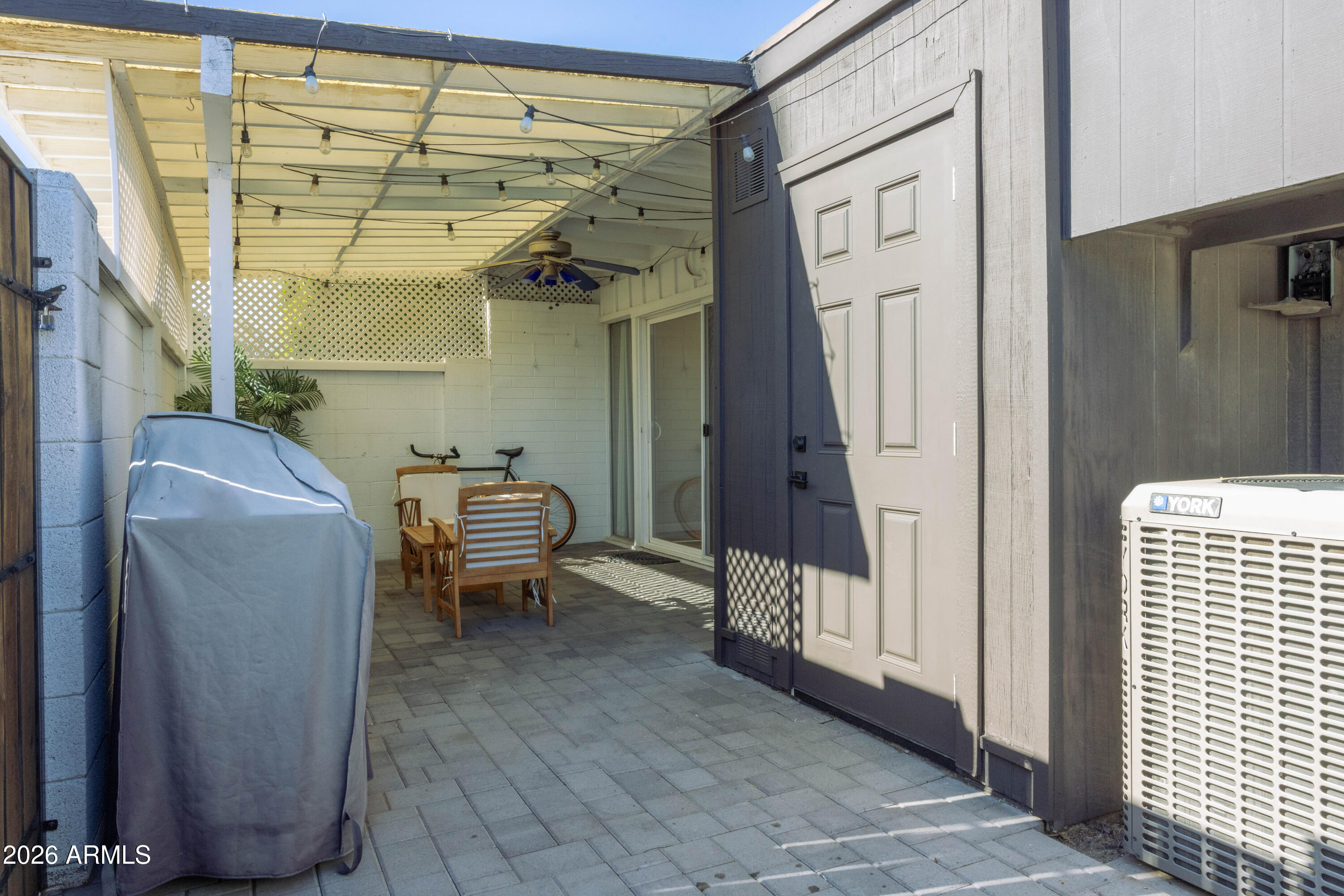 1450 East Bethany Home Road, Unit 31 Phoenix, AZ 85014 - Photo 13 of 24 a hallway with a couch and a window