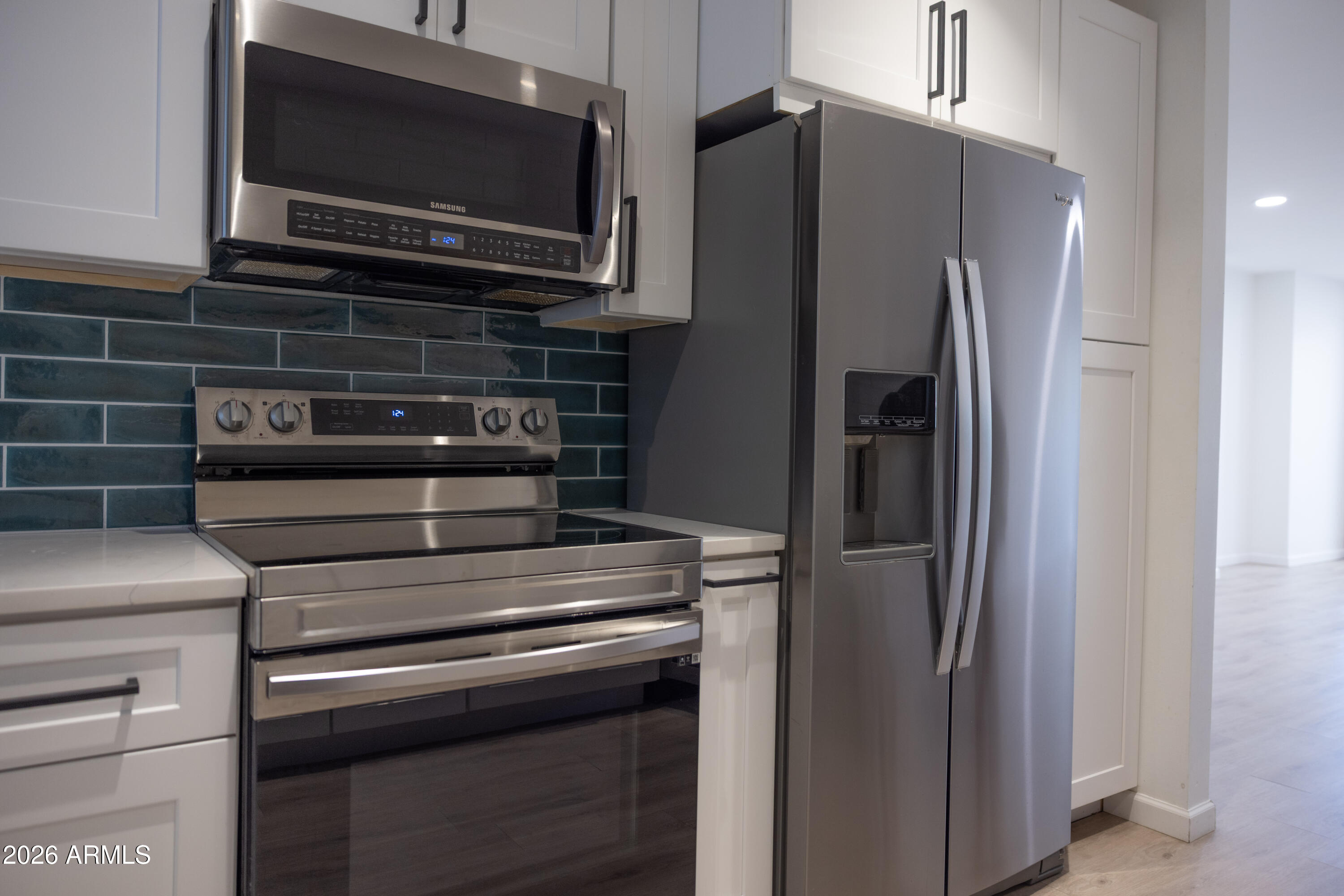 1450 East Bethany Home Road, Unit 31 Phoenix, AZ 85014 - Photo 19 of 24 a kitchen with appliances and cabinets