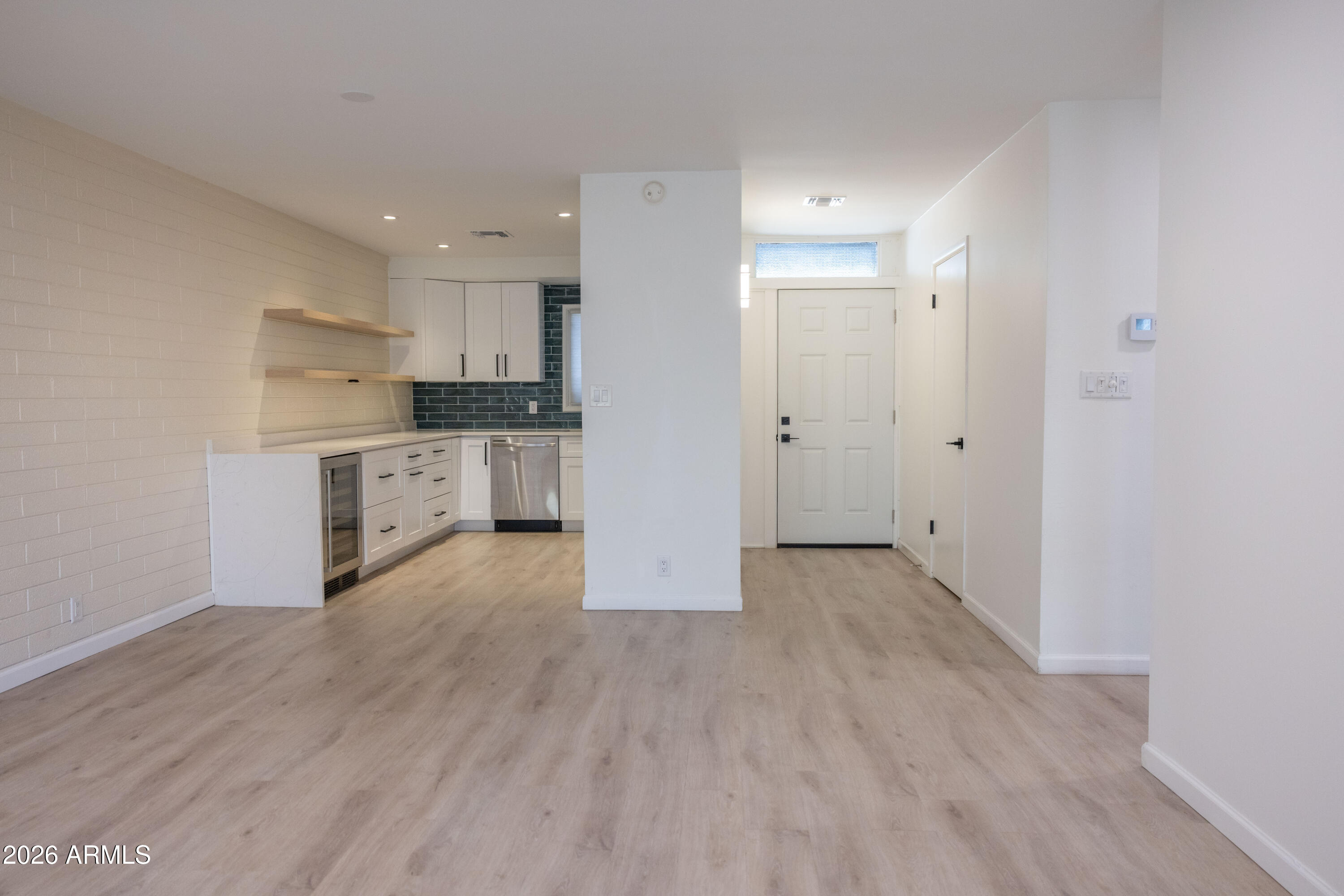 1450 East Bethany Home Road, Unit 31 Phoenix, AZ 85014 - Photo 7 of 24 a view of kitchen with wooden floor and electronic appliances