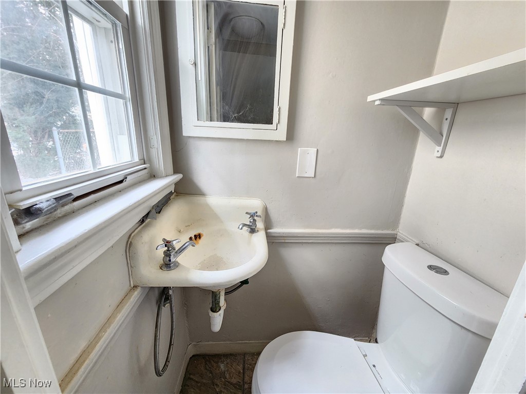 1160 Brentwood Road Cleveland, OH 44121 - Photo 25 of 26 Bathroom featuring sink and toilet