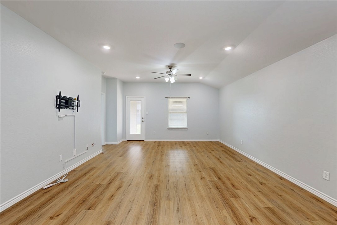 2029 Rock Rdg Avenue Bryan, TX 77807 - Photo 11 of 31 a view of an empty room with wooden floor