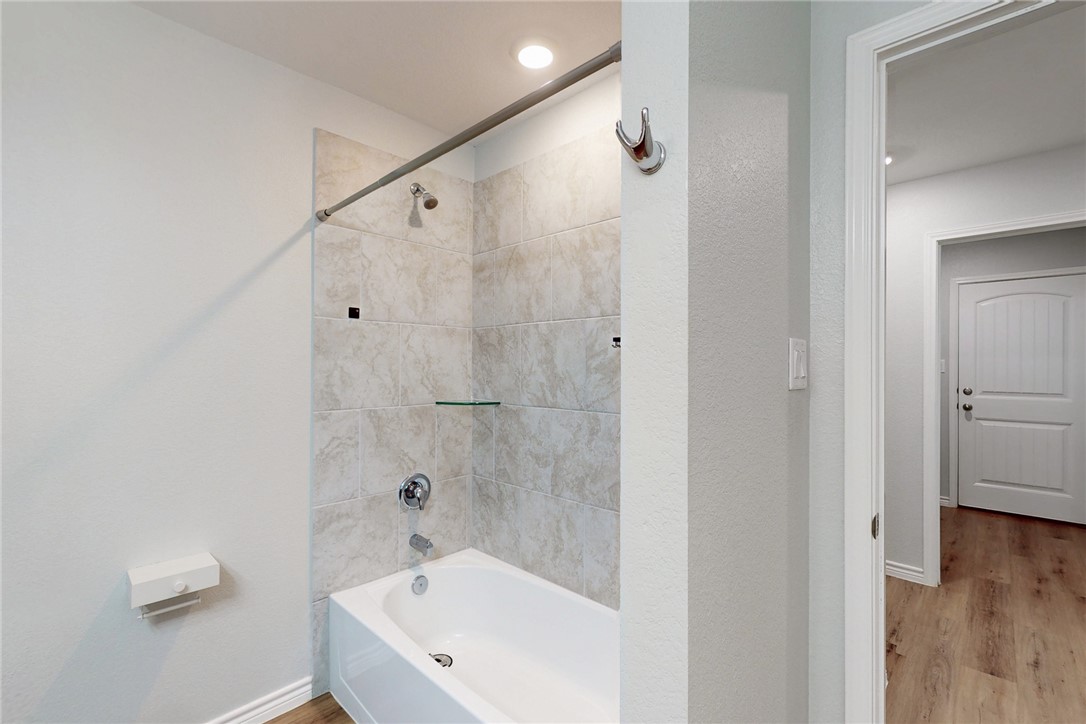 2029 Rock Rdg Avenue Bryan, TX 77807 - Photo 14 of 31 a bathroom with a bathtub and a shower