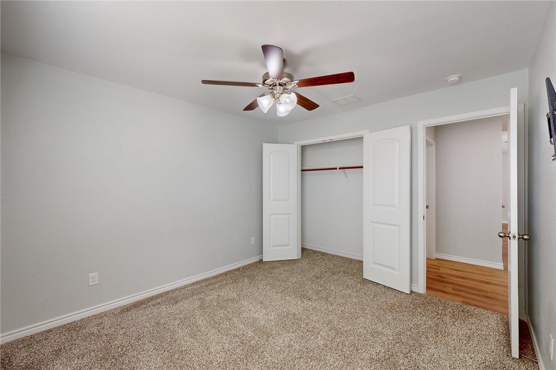 2029 Rock Rdg Avenue Bryan, TX 77807 - Photo 17 of 31 an empty room with closet and a ceiling fan
